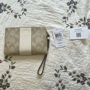 Light tan coach wristlet. New with tags.